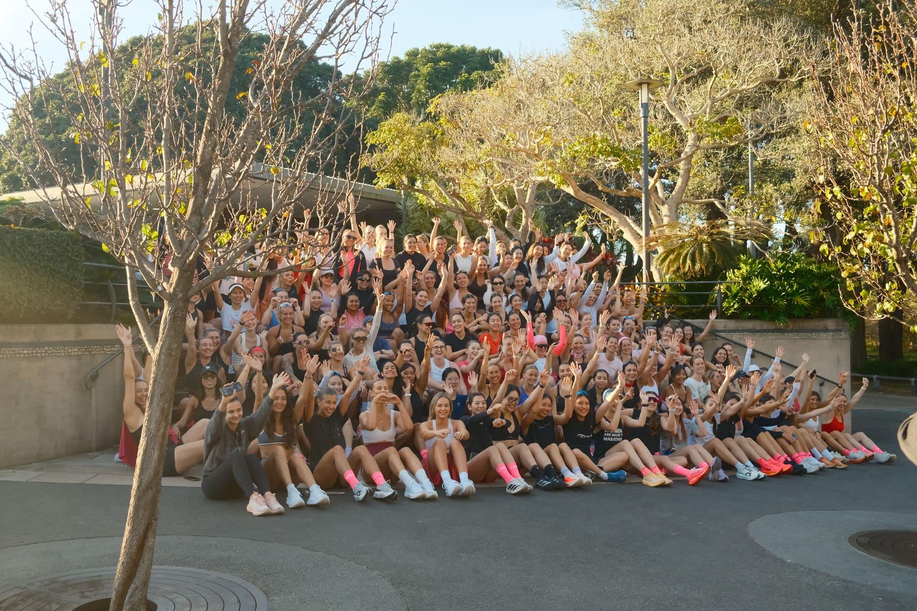 Hundreds of members together for a group photo in the park
